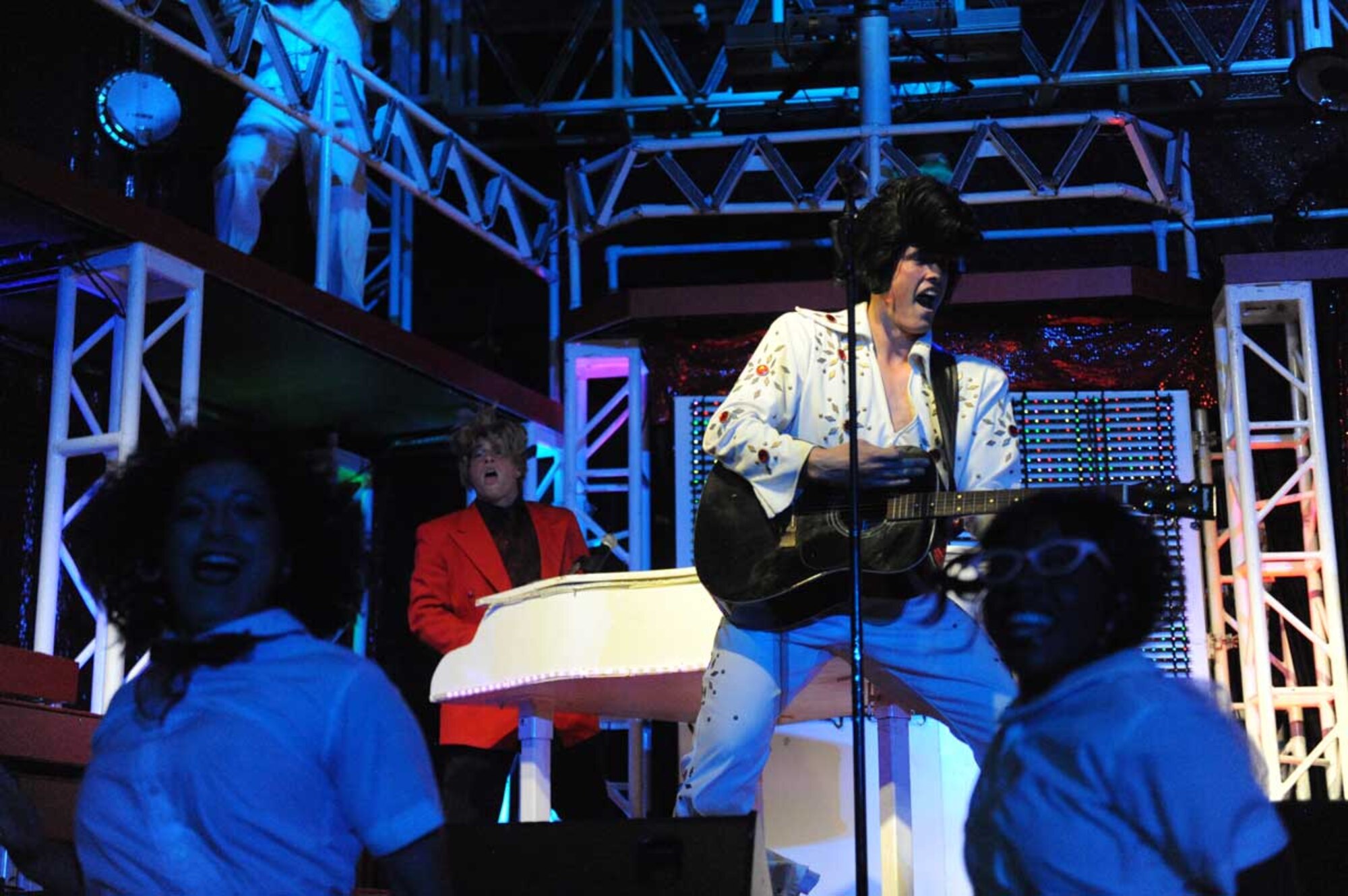 Tops in Blue Airmen dressed as Jerry Lee Lewis and Elvis Presley perform at Talkeetna Theater Monday. Tops in Blue is the all-Air Force show that travels the world, entertaining Airmen and families with song and dance. (U.S. Air Force photo/Airman 1st Class Ty-Rico Lea)