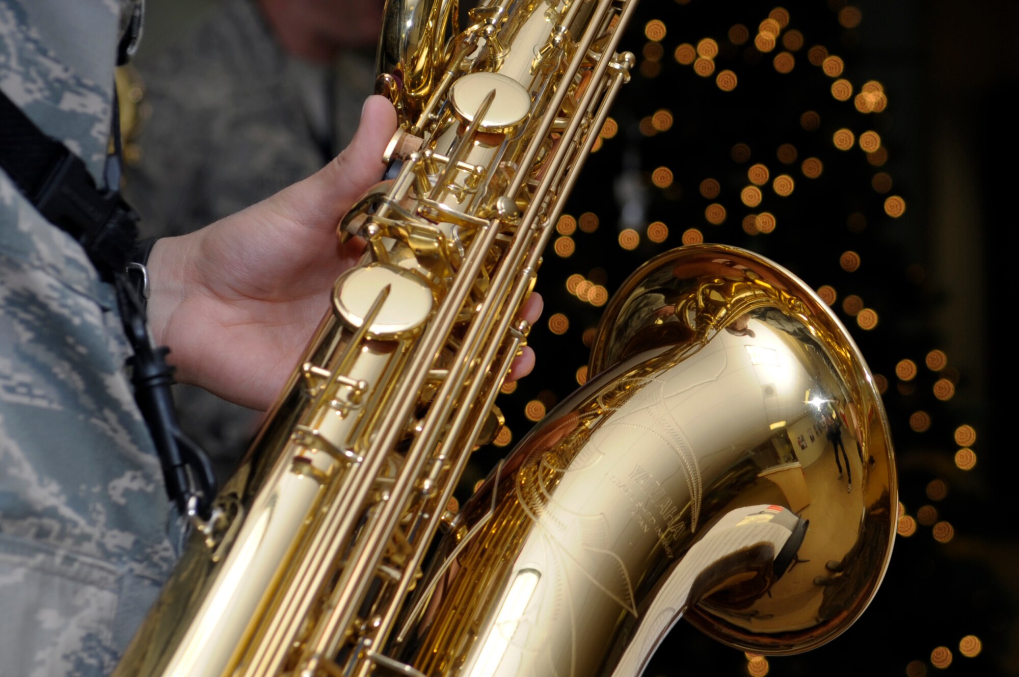 VANDENBERG AIR FORCE BASE, Calif. -- A saxophone quartet from the Band of the Golden West from Travis AFB, Calif., plays Christmas carols in the 30th Medical Group foyer here Thursday, Dec. 8, 2011. The quartet toured main base and played Christmas songs to members of Vandenberg. (U.S. Air Force photo/Jerry E. Clemens Jr.)