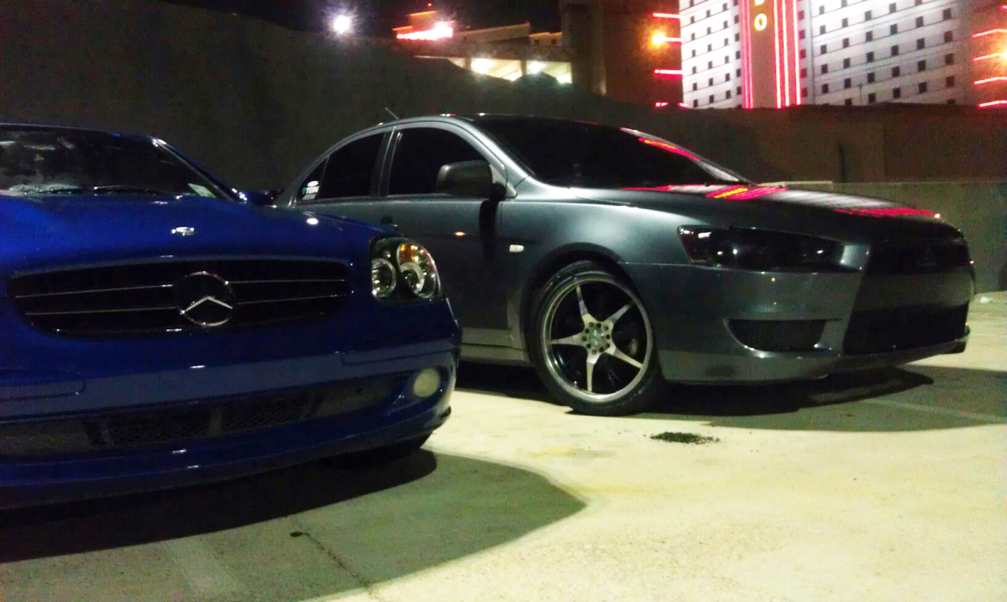 Two cars are displayed on the top floor of a parking garage in Shreveport, La., Nov. 8. The cars belong to members of the Limitless car club that was organized by four Airmen from Barksdale Air Force Base, La., in October. (Courtesy Photo)(RELEASED)