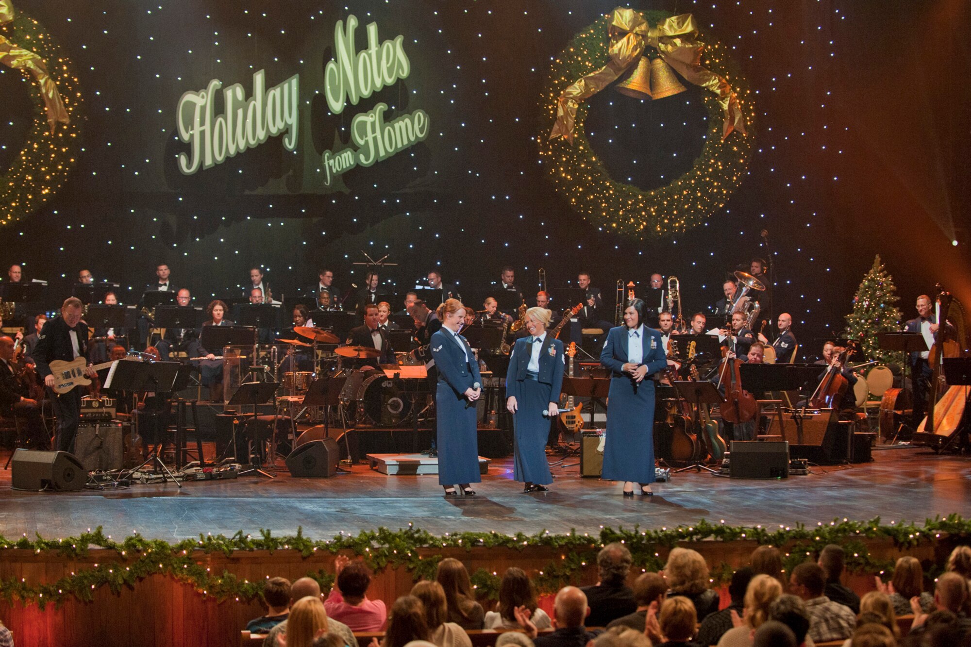 The Band of the U.S. Air Force Reserve and Air Force Strings perform at the Grand Ole Opry House in Nashville, Tenn., during the taping of “Holiday Notes from Home.”  The band joined Lee Ann Womack, and Little Big Town to record the hour-long special that will air on the American Forces Network and the Great American Country Network this holiday season. (U.S. Air Force photo/Ken Hackman)