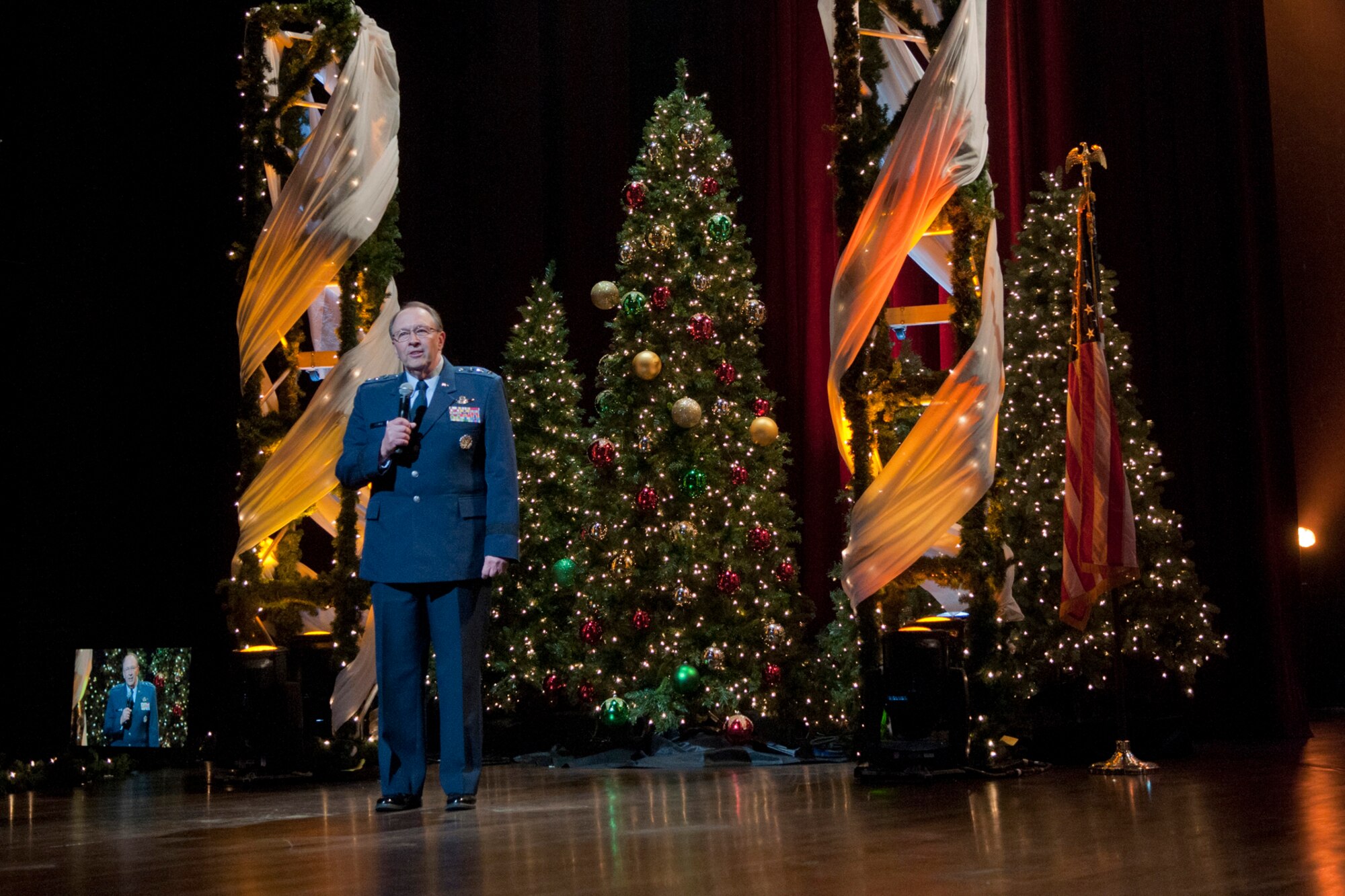 Lt. Gen. Charles E. Stenner, Jr., commander Air Force Reserve Command, makes remarks during the taping of "Holiday Notes from Home" at the Grand Ole Opry House, in Nashville, Tenn. The Band of the U.S. Air Force Reserve and the Air Force Strings joined Grammy winning vocalist Lee Ann Womack and Little Big Town to record the hour-long special that will air on the American Forces Network and the Great American Country Network this holiday season. (U.S. Air Force photo/Ken Hackman)