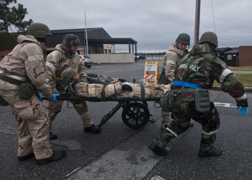 Airmen from the 23rd Medical Group evacuate a patient who was injured by a simulated suicide bomber during a phase II operational readiness exercise at Moody Air Force Base, Ga., Dec. 7, 2011. The ORE is one of many exercises that will help prepare the base for an operational readiness inspection to be held March 28 through April 3 of next year. During exercises and inspections, Moody Airmen are tested on their ability to be combat ready and to deploy at a moment’s notice. (U.S. Air Force photo by Senior Airman Eileen Meier/Released)
