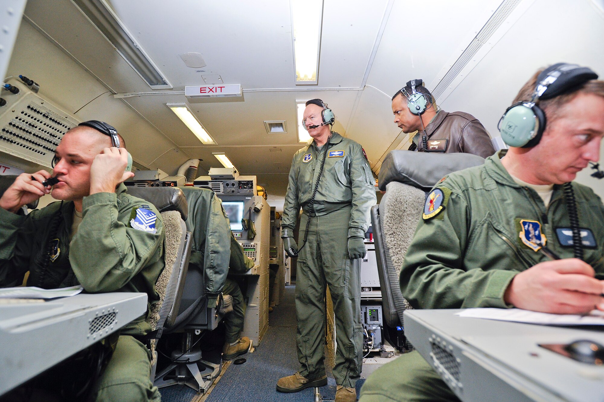 Lt. Gen. Harry Wyatt III, left,  Air National Guard (ANG) director and Col. David Gross, ANG Executive Officer, observe E-8 Joint STARS (JSTARS) crewmembers working at their battle stations during an orientation flight, Robins Air Force Base, Ga., Dec. 05, 2011.  Wyatt went on the flight to learn more about the capabilities of the JSTARS weapon system.  (National Guard photo by Master Sgt. Roger Parsons/Released)