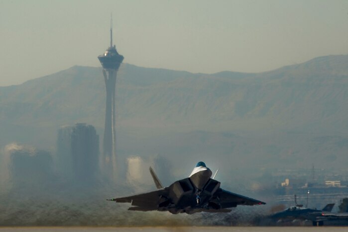 A U.S. Air Force F-22 Raptor, departs for a training mission during the U.S. Air Force Weapons School mission employment exercise Dec. 7, 2011, at Nellis Air Force Base, Nev. The two-week-long mission employment phase is the final part of a five-and-a-half-month Weapons School graduate course that showcases the students newly acquired skills to test their ability to plan, execute and lead complex missions. (U.S. Air Force photo by Airman 1st Class Daniel Hughes/Released)