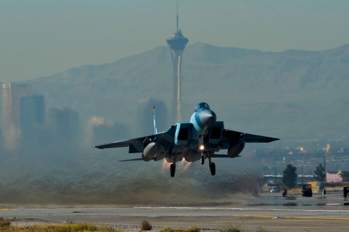 A U.S. Air Force F-15 Strike Eagle, departs for a training mission during the U.S. Air Force Weapons School mission employment exercise Dec. 7, 2011, at Nellis Air Force Base, Nev. The two-week-long mission employment phase is the final part of a five-and-a-half-month Weapons School graduate course that showcases the students newly acquired skills to test their ability to plan, execute and lead complex missions. (U.S. Air Force photo by Airman 1st Class Daniel Hughes/Released)