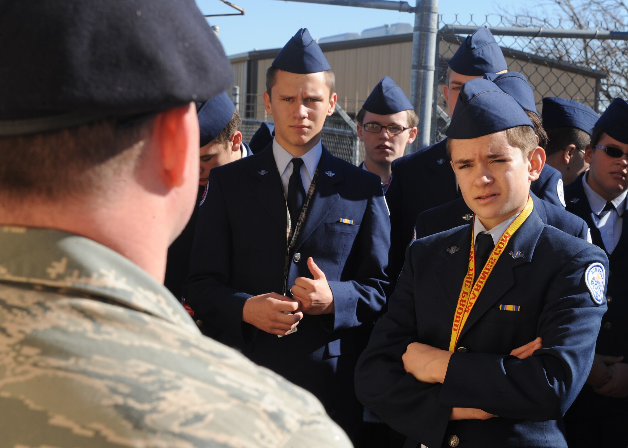 Cooper High School students ask an airman from the 7th Security Forces Squadron how to prepare for being a military working dog handler during a base tour Dec. 7, 2011, at Dyess Air Force Base, Texas. Military working dogs are trained to detect explosives and drugs while also protecting their handler. (U.S. Air Force photo by Airman 1st Class Jonathan Stefanko/ Released)