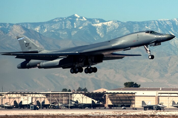 A U.S. Air Force B-1 Lancer, 77th Weapons Squadron, Dyess Air Force Base, Texas, departs for a training mission during the U.S. Air Force Weapons School mission employment exercise Dec. 7, 2011, at Nellis Air Force Base, Nev. The two-week-long mission employment phase is the final part of a five-and-a-half-month Weapons School graduate course that showcases the students newly acquired skills to test their ability to plan, execute and lead complex missions. (U.S. Air Force photo by Staff Sgt. Christopher Hubenthal/Released)