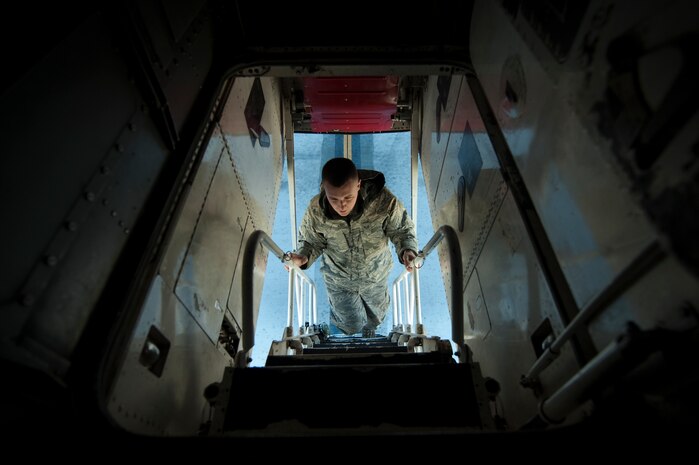 U.S. Air Force Senior Airman Billy Trusty, 7th Aircraft Maintenance Squadron crew chief, Dyess Air Force Base, Texas, prepares to perform pre-flight inspections inside a B-1 Lancer, 77th Weapons Squadron, Dyess Air Force Base, Texas, during the U.S. Air Force Weapons School mission employment exercise Dec. 7, 2011, at Nellis Air Force Base, Nev. The two-week-long mission employment phase is the final part of a five-and-a-half-month Weapons School graduate course that showcases the students newly acquired skills to test their ability to plan, execute and lead complex missions. (U.S. Air Force photo by Staff Sgt. Christopher Hubenthal/Released)
