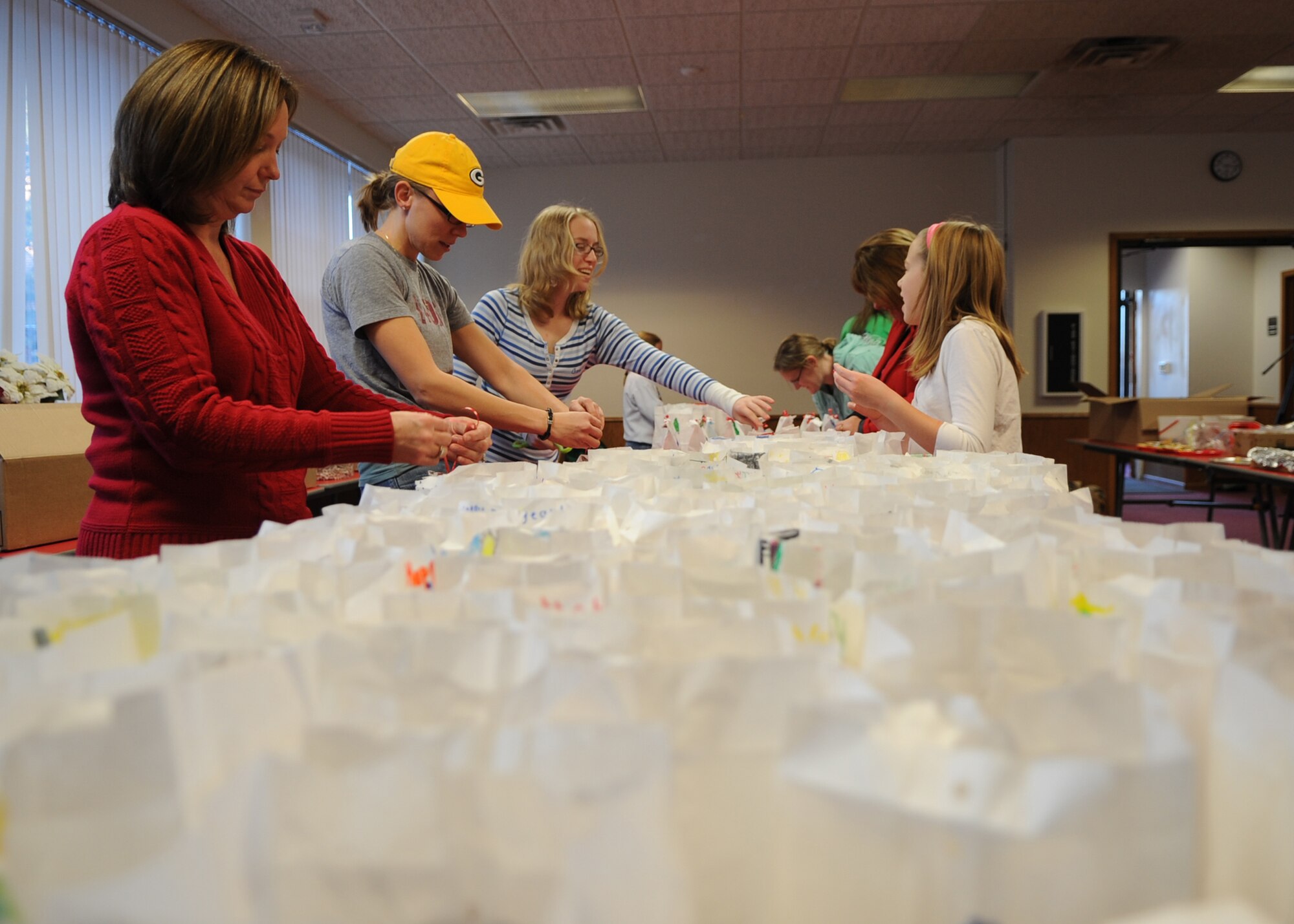 MINOT AIR FORCE BASE, N.D. – Team Minot volunteers collect cookie donations annually to be distributed to Minot Airmen living in the dormitories. Thousands of cookies were collected in three different locations. After cookies are gathered and divided into bags, Minot first sergeants pass the cookies out to the dormitory Airmen. (U.S. Air Force photo/Senior Airman Ashley N. Avecilla)