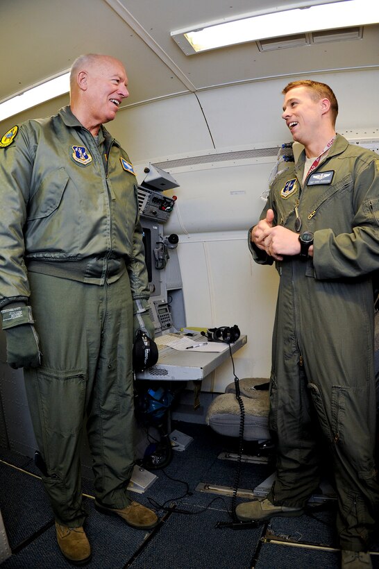 Lt. Gen. Harry Wyatt III, left, Air National Guard (ANG) director, talks with ANG Tech. Sgt. Mike Farrand, E-8 Joint STARS (JSTARS) crewmember, during an orientation flight, Robins Air Force Base, Ga., Dec. 05, 2011.  Wyatt went on the flight to learn more about the capabilities of the JSTARS weapon system.
(National Guard photo by Master Sgt. Roger Parsons/Released)
