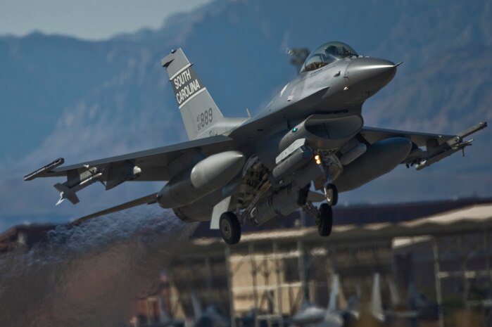 A U.S. Air Force F-16 Fighting Falcon takes off during the U.S. Air Force Weapons School mission employment exercise Dec. 5, 2011, at Nellis Air Force Base, Nev. The two-week-long mission employment phase is the final part of a five-and-a-half-month Weapons School graduate course that showcases the students newly acquired skills to test their ability to plan, execute and lead complex missions. (U.S. Air Force photo by Airman 1st Class Matthew Lancaster/Released)
