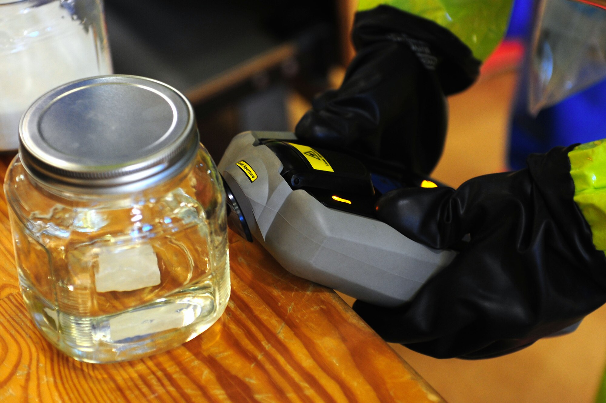 U.S. Air Force Senior Airman Ryan Woody, 633rd Civil Engineer Squadron emergency management flight, uses the Ahura FirstDefender system to test unidentified substances during the HAZMAT portion of an active shooter exercise at Langley Air Force Base, Va., Dec. 8, 2011. The exercise helped to prepare 633rd Air Base Wing personnel for future exercises and potential real-world situations. (U.S. Air Force photo by Airman 1st Class Kayla Newman/Released)