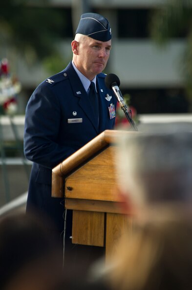U.S. Air Force Col. Sam C. Barrett 115th Wing commander gives a speech Dec. 7, 2011, during the Joint Base Pearl Harbor-Hickam remembrance ceremony in recognition of the 70th Anniversary of the Japanese attacks on the Hawaiian Island of Oahu.  Airmen, their families and veterans gathered at Atterbury Circle, the site of the same flagpole that stood during the attack on Hickam field Dec. 7, 1941. The ceremony was held to honor the survivors of the attacks and remember the 238 Army Air Corps Airmen who died defending Hickam Field. (U.S.  Air Force photo by Tech. Sgt. Michael R. Holzworth/Released)