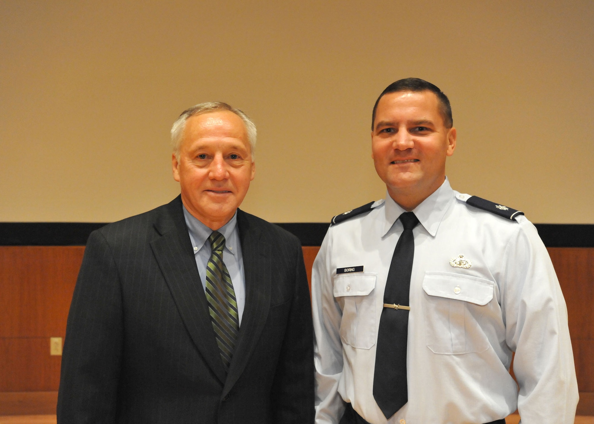 Bruce Carlson, National Reconnaissance Officer director, meets with Lt. Col. Chris Boring, AFMC/NRO Liaison Officer, during a conference here earlier this year.    