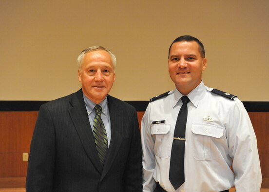 Bruce Carlson, National Reconnaissance Officer director, meets with Lt. Col. Chris Boring, AFMC/NRO Liaison Officer, during a conference here earlier this year.    