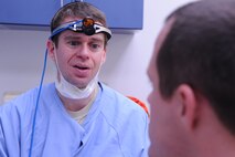 Capt. Jonathan Norris debriefs a patient after a refill cavity procedure on Seymour Johnson Air Force Base, N.C., Dec. 7, 2011. A debrief includes reviewing the procedure, giving expectations for the next few hours and answering patient’s questions. Norris is a 4th Aerospace Medicine Squadron dentist from Virginia Beach, Va. (U.S. Air Force photo by Senior Airman Whitney Stanfield) 