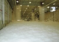 Torrents of foam flow from ceiling nozzles during a test of an aircraft hangar’s fire suppression system at Duke Field, Fla., recently. The test, conducted by contractor Barlovento, LLC and the U.S. Army Corps of Engineers, was required for final certification of the newly refurbished hangar prior to its official reopening. (U.S. Air Force photo/Dan Neely)