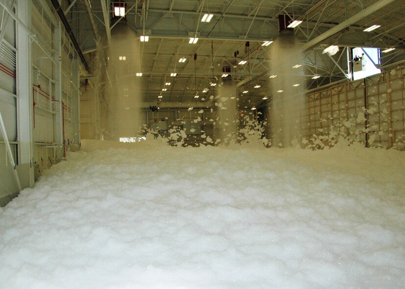 Torrents of foam flow from ceiling nozzles during a test of an aircraft hangar’s fire suppression system at Duke Field, Fla., recently. The test, conducted by contractor Barlovento, LLC and the U.S. Army Corps of Engineers, was required for final certification of the newly refurbished hangar prior to its official reopening. (U.S. Air Force photo/Dan Neely)