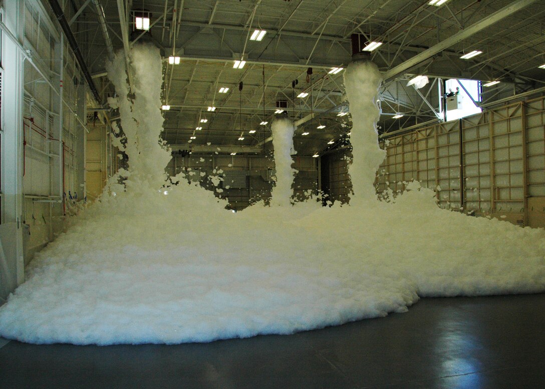 Torrents of foam flow from ceiling nozzles during a test of an aircraft hangar’s fire suppression system at Duke Field, Fla., recently. The test, conducted by contractor Barlovento, LLC and the U.S. Army Corps of Engineers, was required for final certification of the newly refurbished hangar prior to its official reopening. (U.S. Air Force photo/Dan Neely)