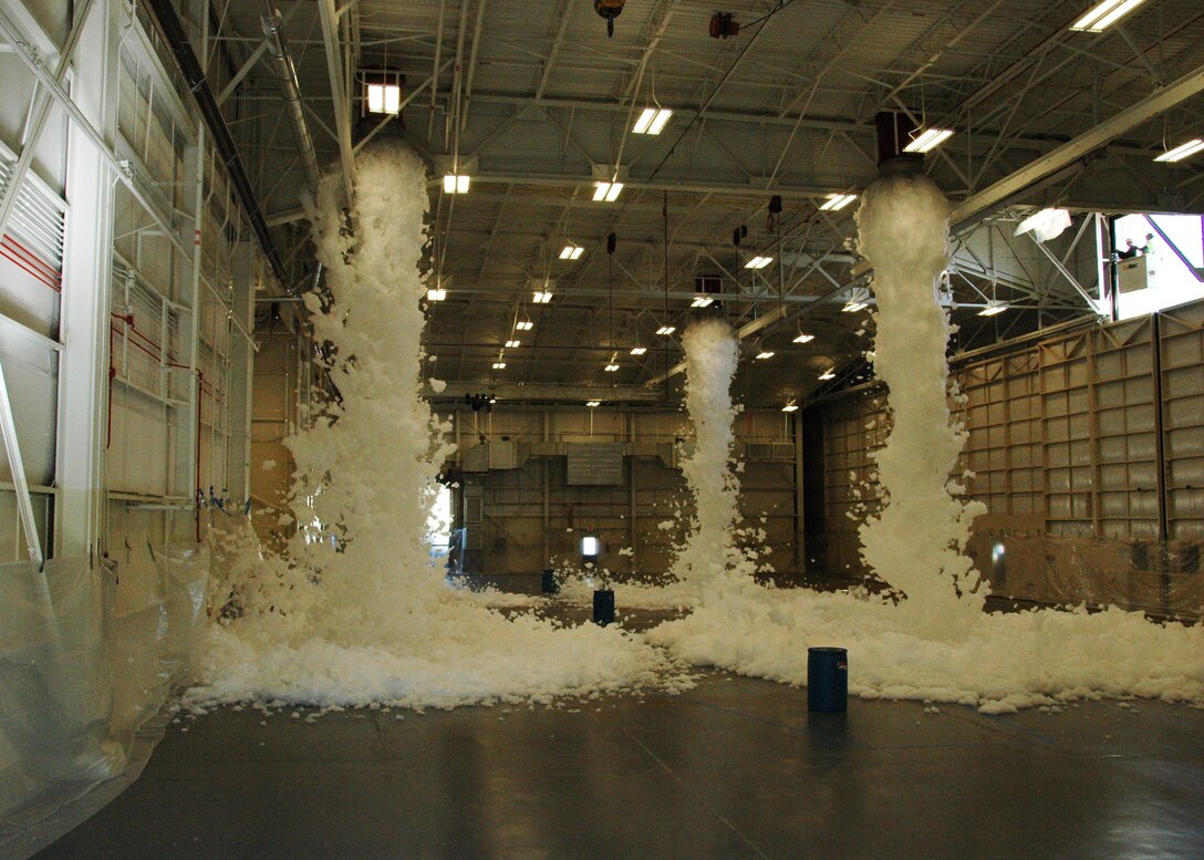 Torrents of foam flow from ceiling nozzles during a test of an aircraft hangar’s fire suppression system at Duke Field, Fla., recently. The test, conducted by contractor Barlovento, LLC and the U.S. Army Corps of Engineers, was required for final certification of the newly refurbished hangar prior to its official reopening. (U.S. Air Force photo/Dan Neely)