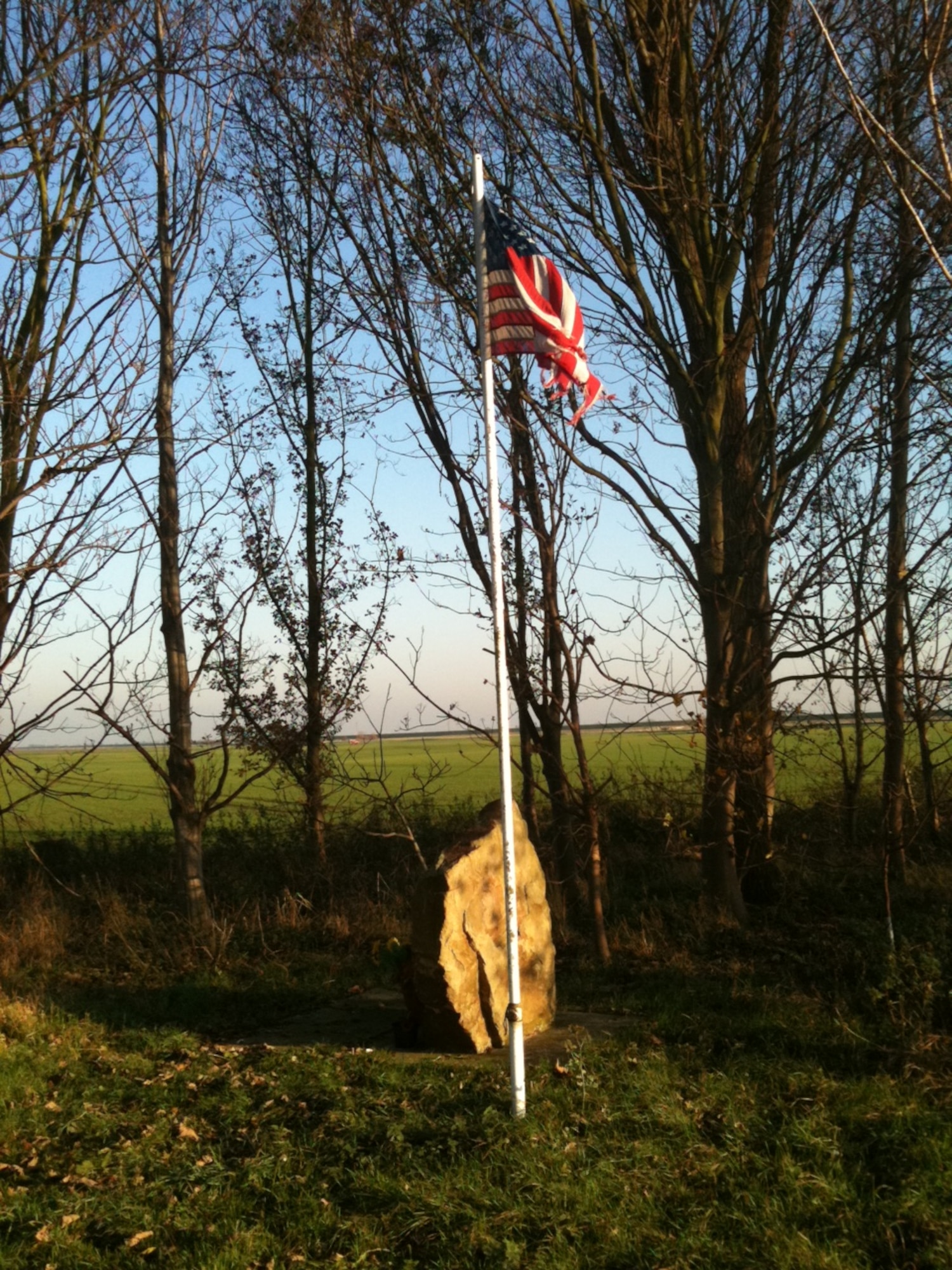 A memorial in need of care.  A memorial near Thorney Hill, England to the airmen who perished when their C-141 transport crashed during a thunderstorm in August 1976 was looking undignified before a team from the JAC team took action to restore the site and fly a new American Flag.   U,S. Air Force photo by Master Sgt. Charles Hajny.