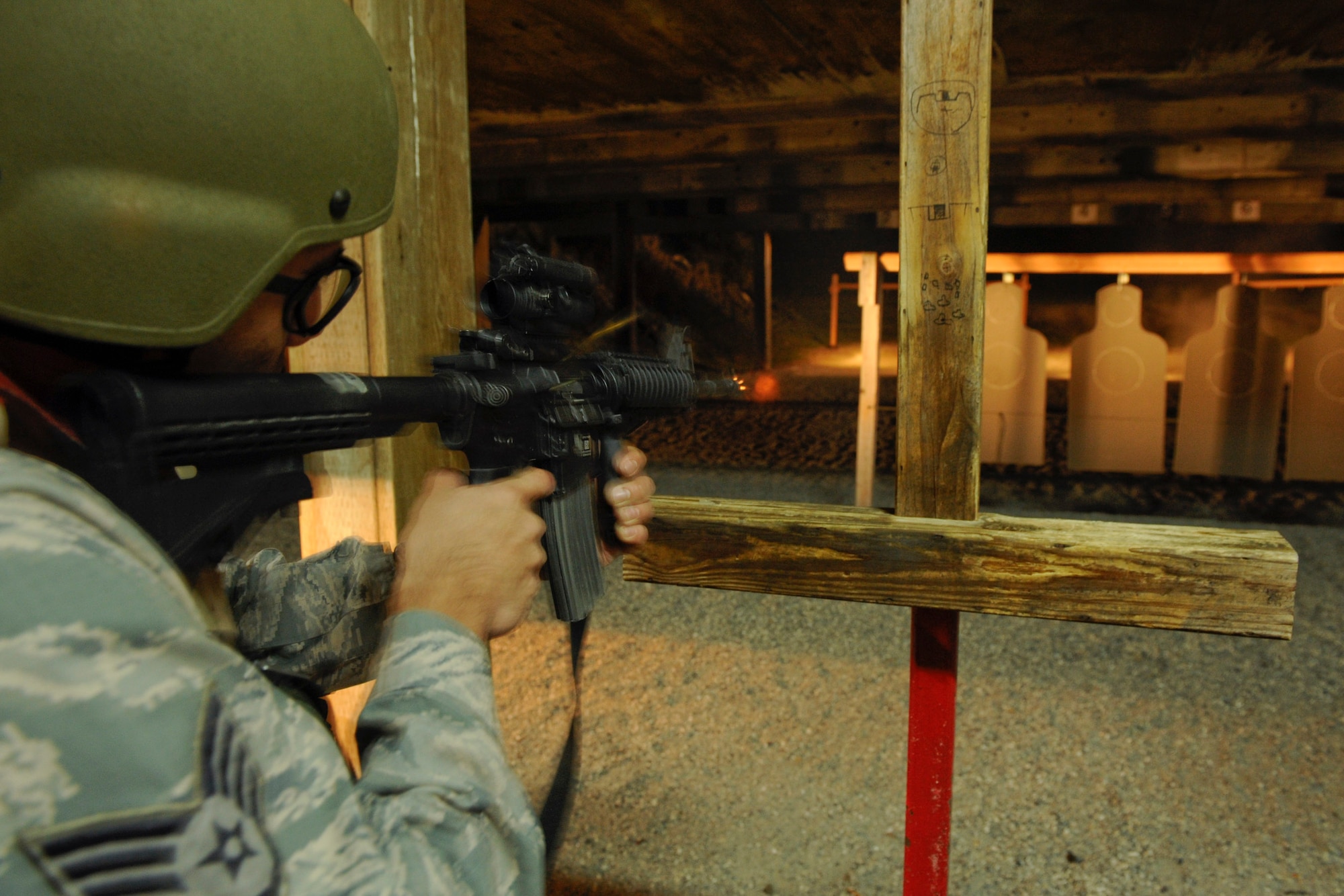 VANDENBERG AIR FORCE BASE, Calif. -- Staff Sgt. Anthony Cardenas, a 382nd Training Squadron resource advisor, fires an M4 carbine during the first class of the new Rifle Carbine Air Force Qualification course here Tuesday, Dec. 6, 2011. The new course, in which Airman fire nearly double the amount of rounds of the previous course, contains both basic firing positions (prone, sitting, kneeling, standing) and advanced tactical movements. (U.S. Air Force/Staff Sgt. Levi Riendeau)