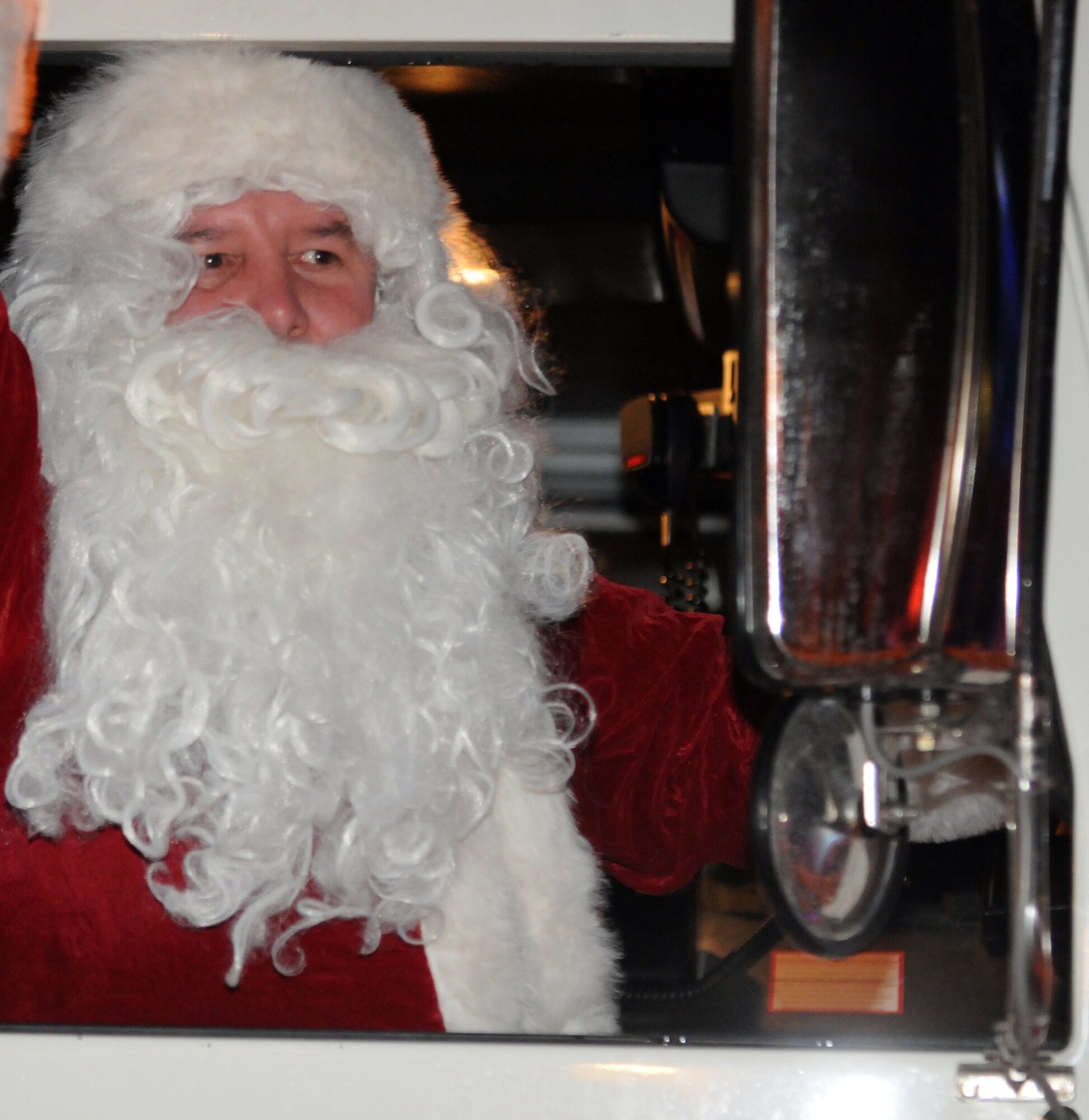 Santa Claus greets people at the annual Christmas tree lighting ceremony Dec. 7 at Aviano Air Base, Italy. This event is a base tradition which kicks-off the holiday season. (U.S. Air Force photo/Airman 1st Class Jenay Randolph)