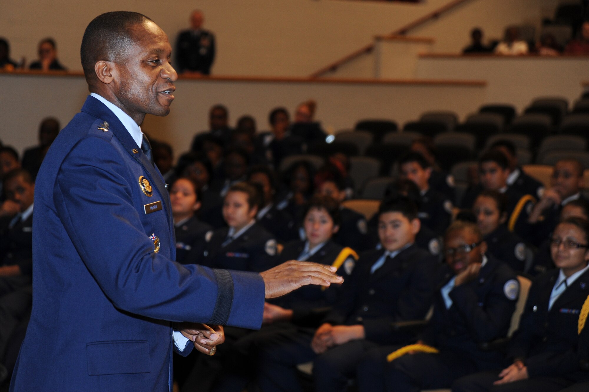 Air Force District of Washington Commander, Maj. Gen. Darren W. McDew, interacts with Bladensburg High School’s Junior Reserve Officer Training Corps cadets Nov. 30, Bladensburg, Md. McDew mentored the students about the core values all Airman live by. “There are no jobs too small – they’re all important, and they need your best every time you do them,” McDew said. (U.S. Air Force photo by Staff Sgt. Christopher Ruano)