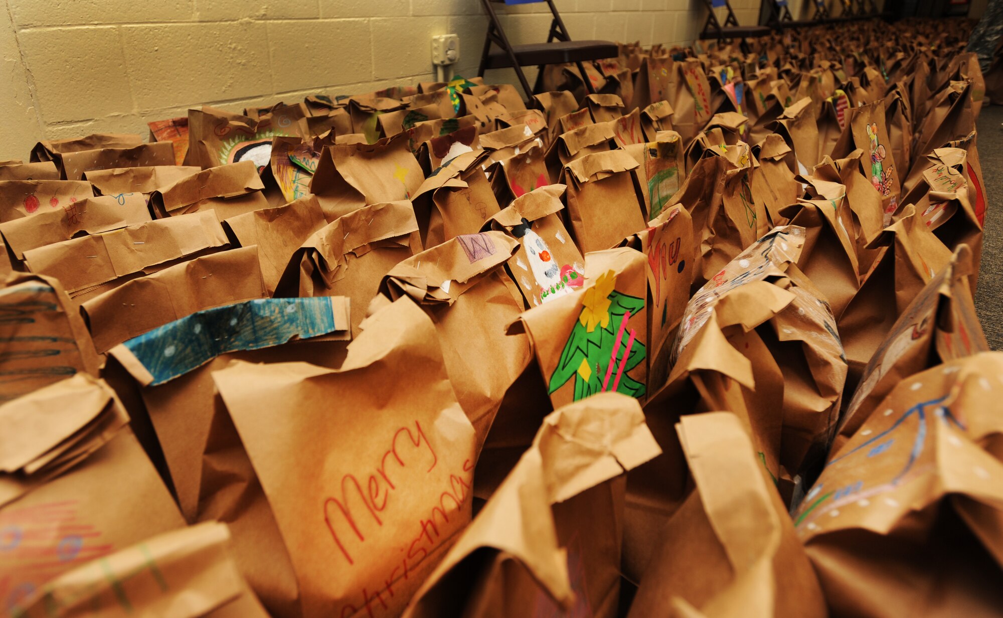 Several members of Sumter and Team Shaw donated 3,710 dozen cookies to an annual cookie drive at the Community Activity Center, Shaw Air Force Base, S.C., Dec. 7, 2011. The cookie drive is an annual program designed to give Christmas cookies to deployed military members as well as Airmen and Soldiers in the dorms. (U.S. Air Force photo by Airman 1st Class Tabatha Duarte/Released)
