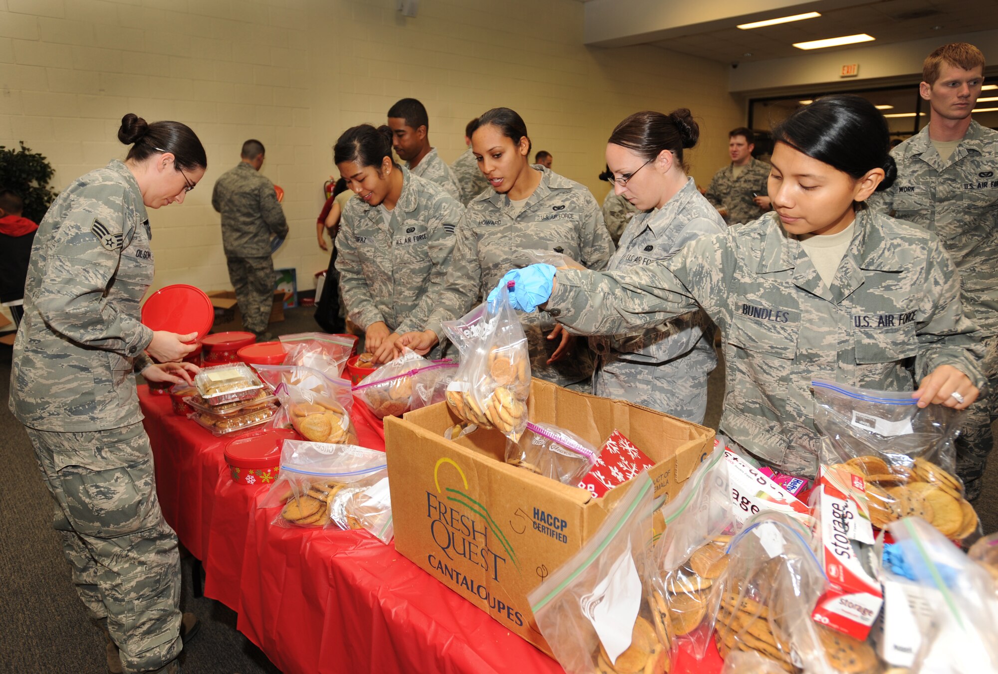 Airman Leadership School students bag cookies at the Community Activity Center, Shaw Air Force Base, S.C., Dec. 7, 2011. The cookie drive is an annual program designed to give Christmas cookies to deployed military members as well as Airmen and Soldiers in the dorms. (U.S. Air Force photo by Airman 1st Class Tabatha Duarte/Released)