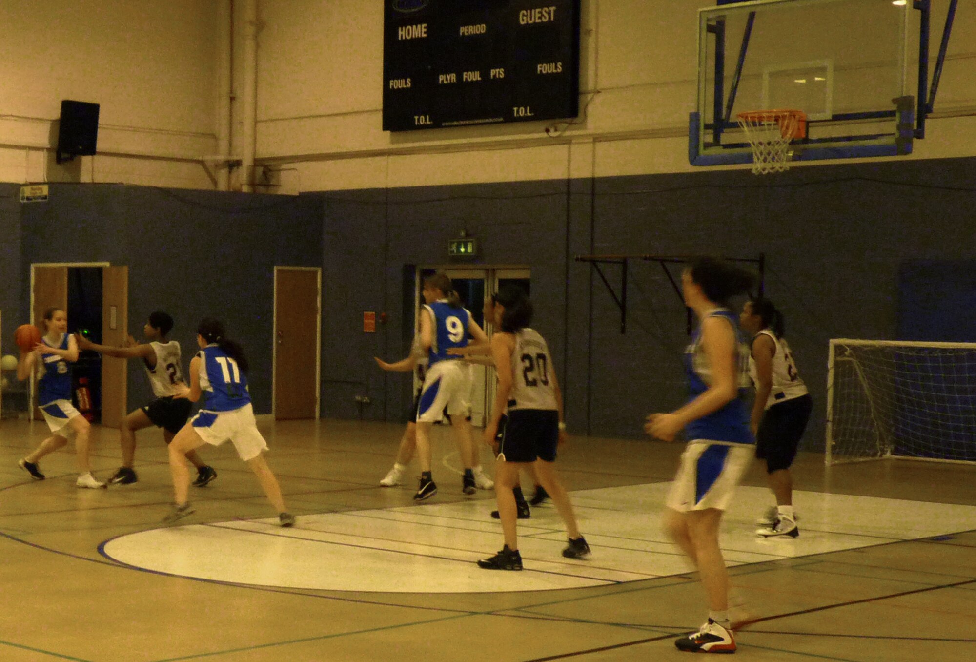 RAF MILDENHALL, England -- A Cambridge Lady Panthers player passes the ball in an exhibition game against the joint RAF Mildenhall and RAF Lakenheath Lady Eagles at the North Side Fitness Center Dec. 1, 2011. The Lady Eagles started their intramural basketball season with a 42-17 win. (Courtesy photo)