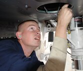 Airman Justin Wischmann, 4th Aircraft Maintenance Squadron crew chief, performs routine maintenance on an F-15E Strike Eagle. Crew chiefs are responsible for inspecting jets after specialty shops like electrical and environmental and avionics are done working on them, ensuring they are ready for take off. Wischmann hails from Flagstaff, Ariz. (U.S. Air Force photo by Senior Airman Gino Reyes)

