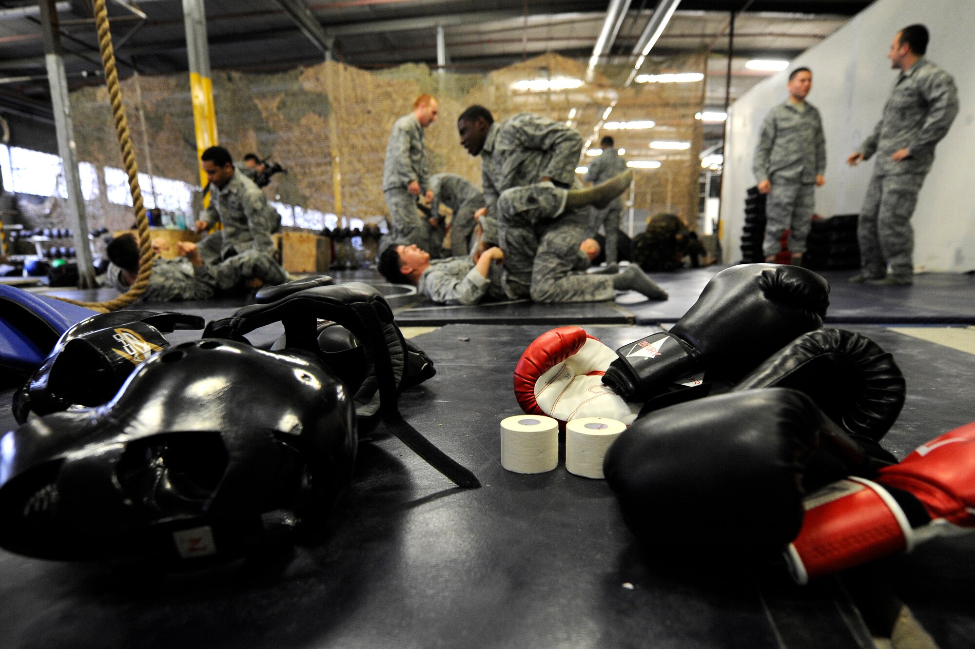 Airmen from the 86th Security Forces and members of the Belgium Army practice modified combative techniques during the flyaway security team training session provided by the 435th Air Ground Operations Wing Dec. 07, 2011, Ramstein Air Base, Germany.  The F.A.S.T specialize in military teams that are in support of contingencies, theater security operation events, humanitarian and civic assistance projects, AEF deployments, and military operations other than war. (U.S. Air Force photo by Staff Sgt. Chris Willis)