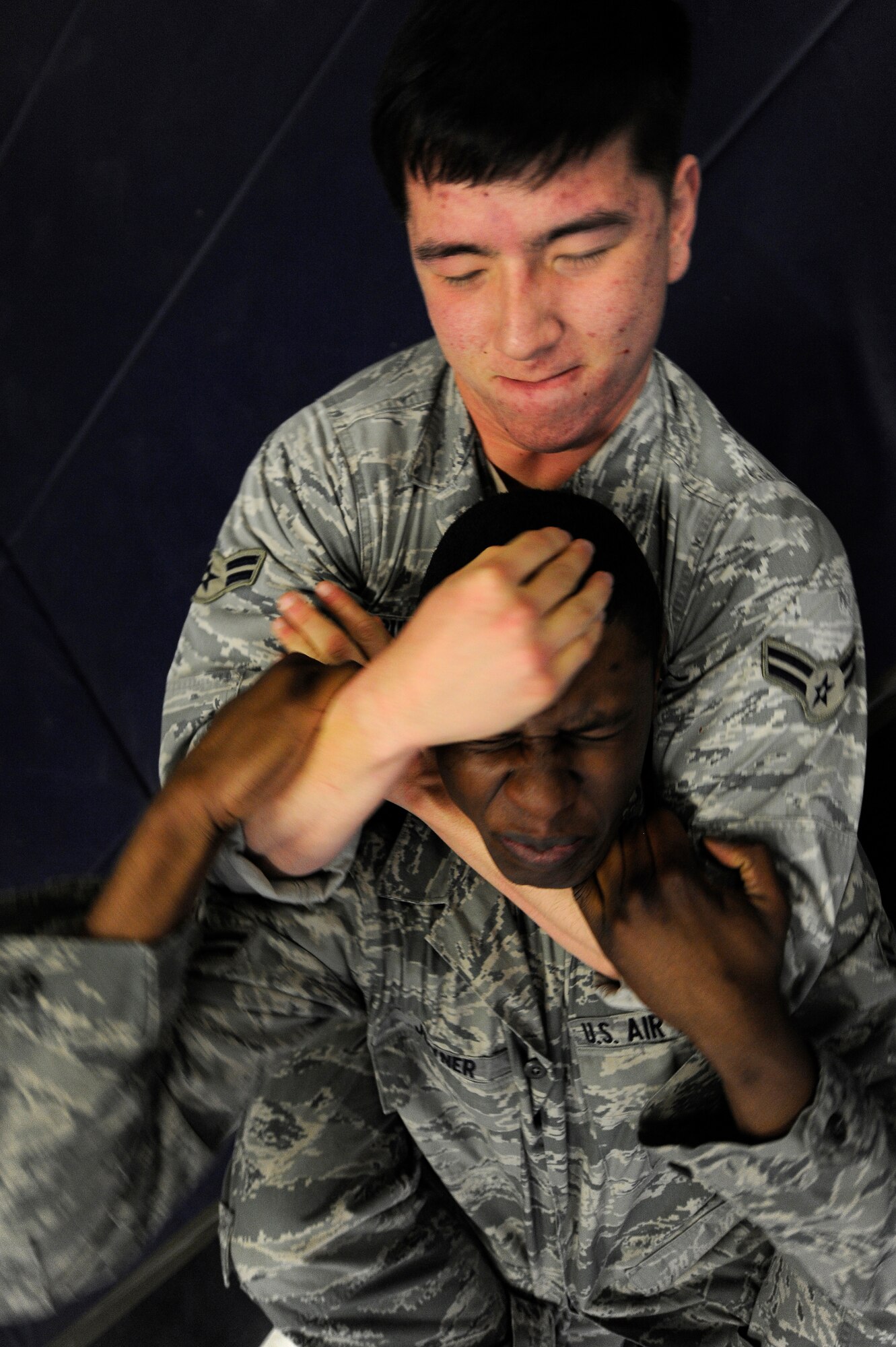 Air Force Airman 1st Class Stephen Buesing and Air Force Airman 1st Class Darren Joyner, 86th Security Forces Squadron members, practice flyaway security team ground combat training Dec. 07, 2011, Ramstein Air Base, Germany.  The F.A.S.T specialize in military teams that are in support of contingencies, theater security operation events, humanitarian and civic assistance projects, AEF deployments, and military operations other than war. (U.S. Air Force photo by Staff Sgt. Chris Willis)