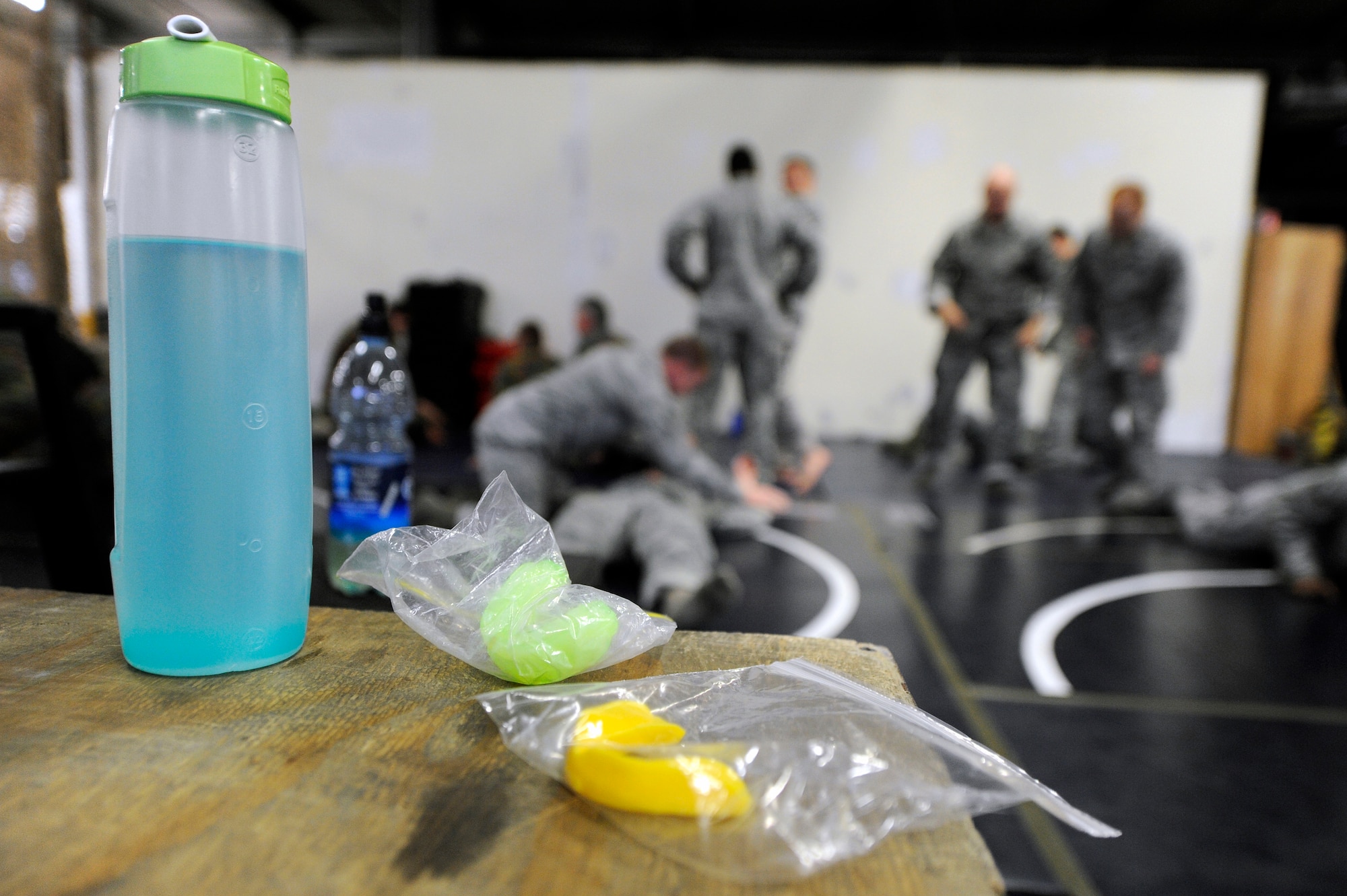 Airmen from the 86th Security Forces and members of the Belgium Army practice modified combative techniques during the flyaway security team training session provided by the 435th Air Ground Operations Wing Dec. 07, 2011, Ramstein Air Base, Germany.  The F.A.S.T specialize in military teams that are in support of contingencies, theater security operation events, humanitarian and civic assistance projects, AEF deployments, and military operations other than war. (U.S. Air Force photo by Staff Sgt. Chris Willis)