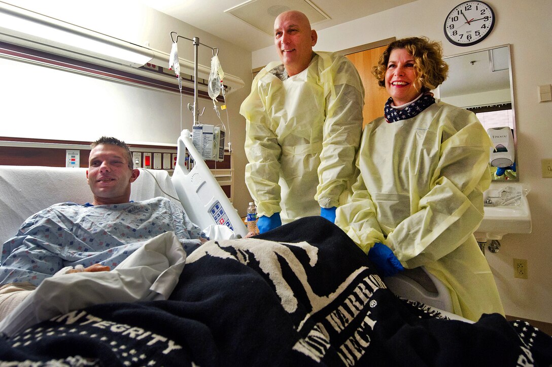 Army Chief of Staff Gen. Raymond T. Odierno and his wife, Linda, share a laugh with Sgt. Brandon Tucker and his family during a visit to San Antonio Military Medical Center, Dec. 5, 2011. Tucker was assigned to the 1st Infantry Division's 4th Battalion, 4th Cavalry Regiment.