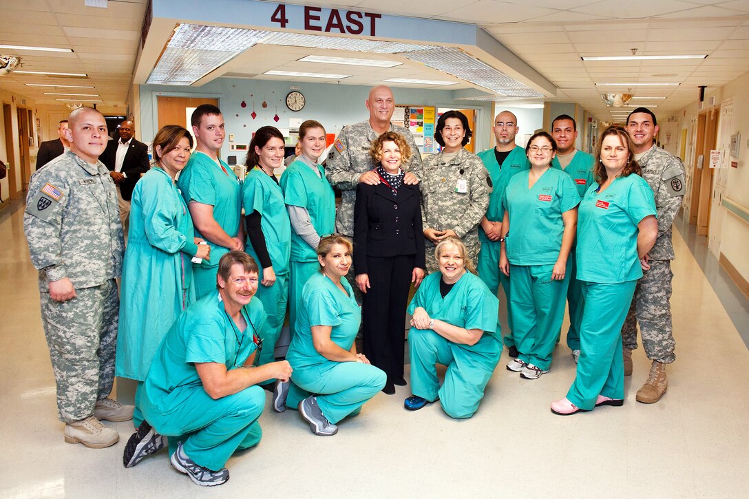 Army Chief of Staff Gen. Raymond T. Odierno and his wife, Linda, pose for a photograph with the staff of the San Antonio Military Medical Center, Dec. 5, 2011.