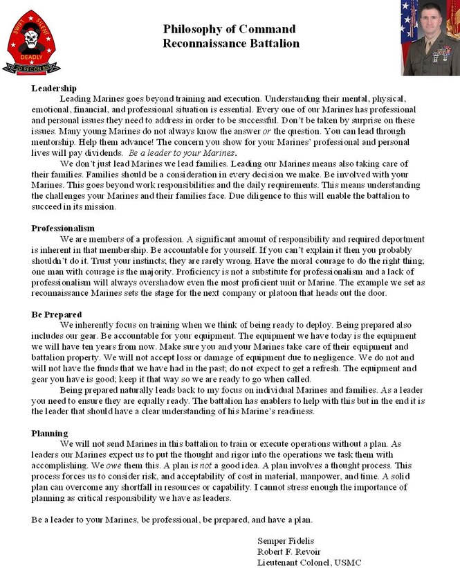 Sgt. Maj. Micheal P. Barrett, the 17th Sergeant Major of the Marine Corps, recieves a gift from 1st Marine Division Band in the Pentagon, Washington D.C., Dec. 8, 2011.