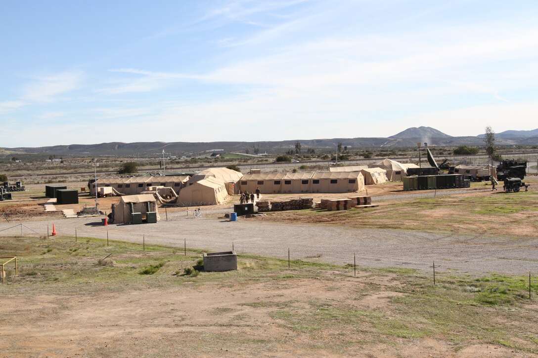 The Marines and sailors of 3d Marine Aircraft Wing (Forward) bring the aviation combat element compound to life aboard Marine Corps Air Station Miramar, Calif., Dec. 8. The 3d MAW (Fwd) personnel are participating in their mission rehearsal exercise (MRX) before deploying in support of Operation Enduring Freedom this winter. At the MRX, Marines and sailors must respond to scenarios they may face while deployed to Afghanistan, such as aircraft mishaps or attacks on 3d MAW (Fwd) convoys.