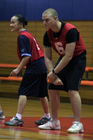 Candice Ho, left, and Bryan S. Otherson, IYAOYAS-B players, wait for the referee to blow the whistle during an intramural dodgeball double-elimination tournament at the IronWorks sports courts here Dec. 9. IYAOYAS A and B fought hard in the tournament, but were not able to put away the Tail Hookers who took first place in the tournament.