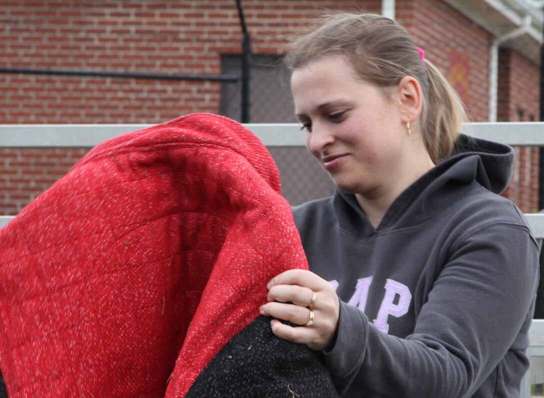 Alex Lehr, a student in the Criminal Justice Society Club, with Craven County Community College looks at bite protection jacket used by the military working dogs handlers during a live demonstration for the Craven County Community College Criminal Justice Society Club Dec. 9. The club takes frequent trips to destinations in Eastern North Carolina including gun ranges, prisons and State Bureau of Investigation crime lab and other places that involve criminal justice.