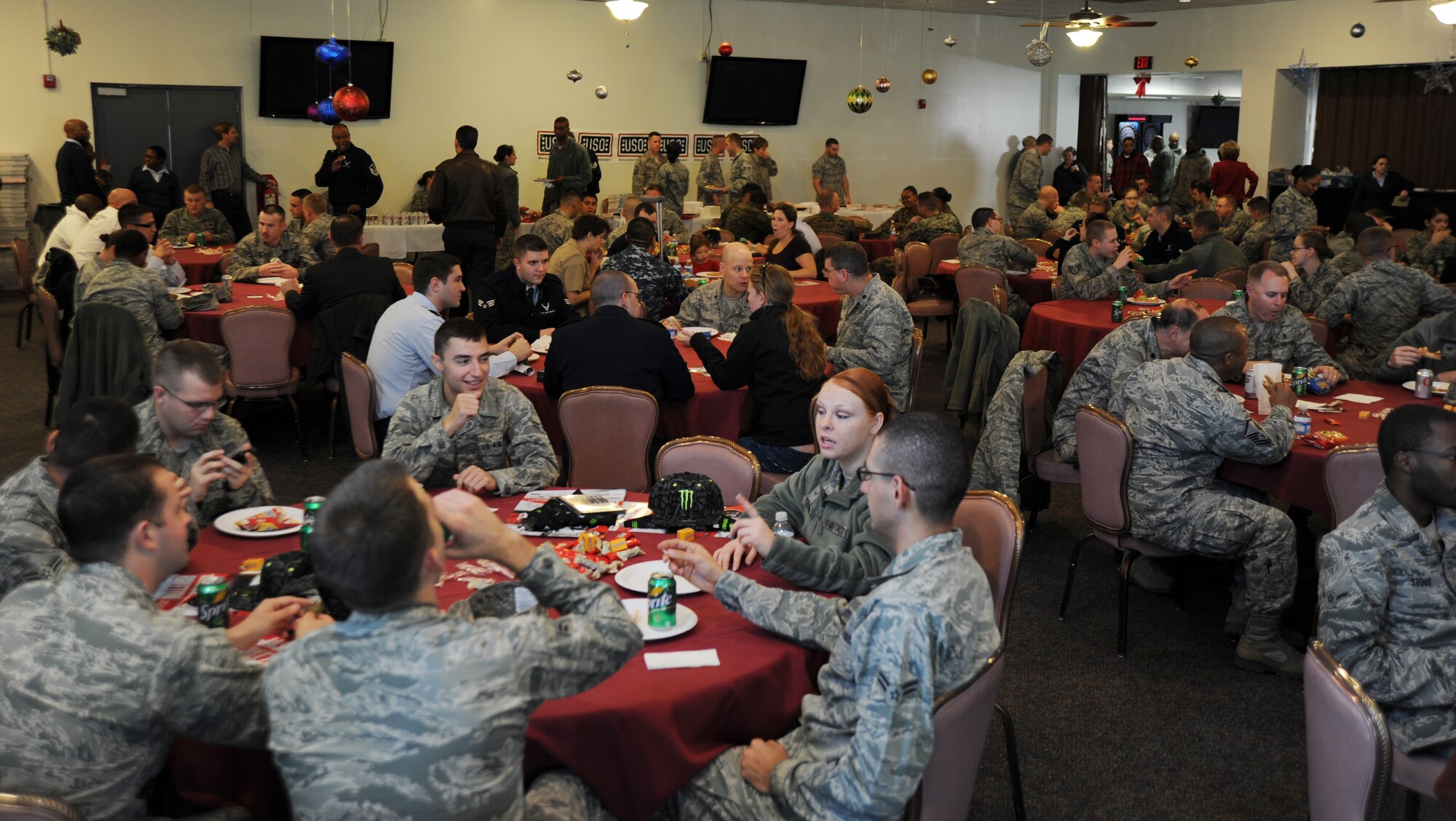 More than 300 Airmen, Sailors and Marines from the local area units came to enjoy the free pizza, music, games and gifts Dec. 8 on Joint Base Andrews, Md. The pizza party was hosted by USO, with guests Jason Britton, sports bike free-style rider, and Santa. (U.S. Air Force photo by Staff Sgt. Christopher Ruano)