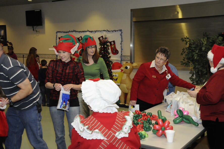 144th Fighter Wing members and their families take part in festivities at the bases annual Christmas party December 7, 2011.(Air Force photo by Tech. Sgt. Charles Vaughn)