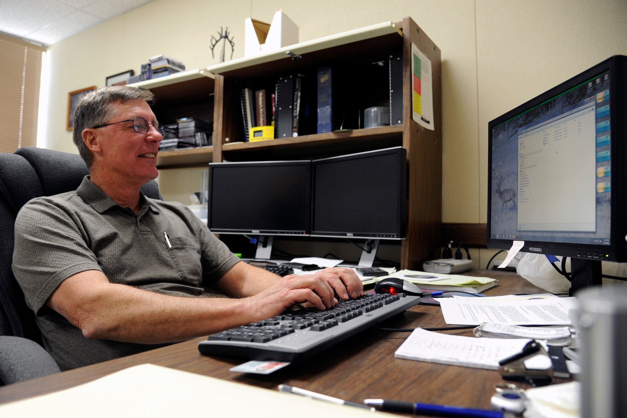 HOLLOMAN AIR FORCE BASE, N.M. -- Dr. Michael Hooser, 846th Test Squadron chief scientist, works on his computer Dec. 8, 2011, at the 846th TS. Hooser was selected for the 2011 Harold Brown Award, the top Air Force award for scientific research and development, based on his work on the rain-field characterization testing and Magnetic Levitation system on the Holloman High Speed Test Track. (U.S. Air Force photo by Airman 1st Class Siuta B. Ika/Released)