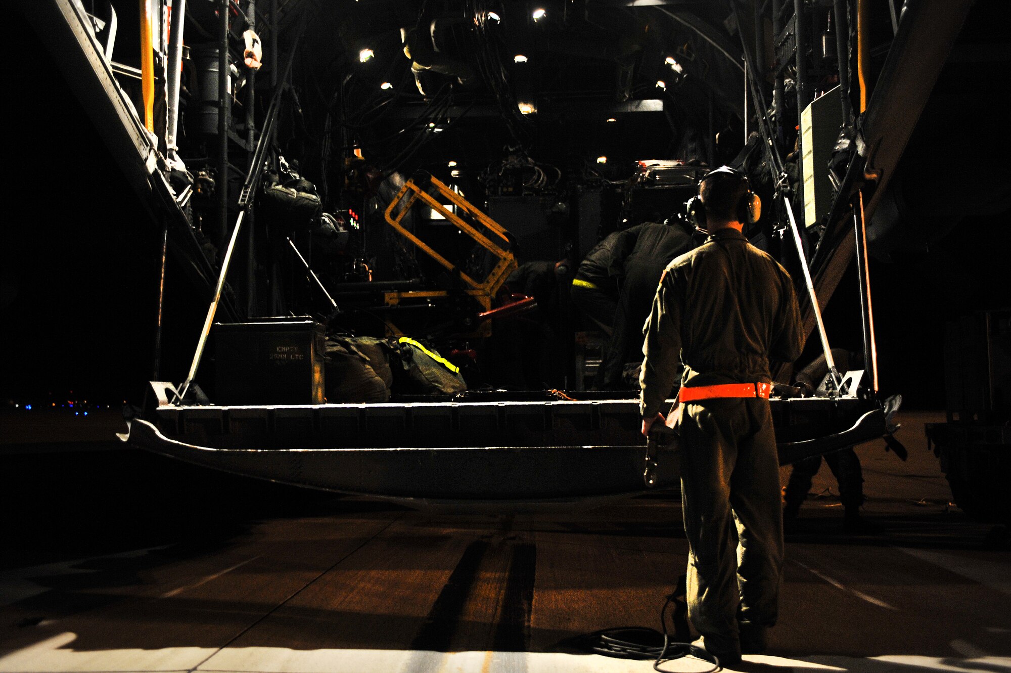 U.S. Air Force Staff Sgt. Robert E. Turner, a member of the 19th Special Operations Squadron, prepares to secure all valuables aboard a C-130 Gunship on Hurlburt Field, Fla. Nov. 30, 2011. Crew members have assignments to ensure each loading is performed effectively. (U.S. Air Force photo/Airman 1st Class Hayden Keith Hyatt)(Released)
