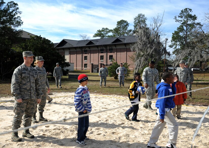 Students from Airmen Leadership School and Memminger Elementary School play volleyball at Joint Base Charleston-Air Base Dec. 8. JB Charleston's Airmen Leadership School invited more than 30 third grade students from Memminger Elementary School to tour the base. The tour is part of an on-going community service project, to bring awareness to the opportunities the Air Force has to offer future generations. (U.S. Air Force photo/Airman 1st Class Ashlee Galloway)