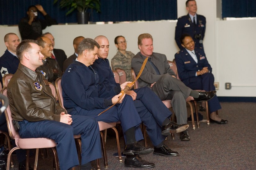 Maj. Gen. Gerald Caron, 79th Medical Wing commander, examines a hand-crafted bow during an American Indian Heritage Month event at the Community Activity Center on Nov 30. (Photo/Bobby Jones)  