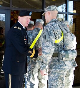 Gen. Robert W. Cone, commanding general of U.S. Army Training and Doctrine Command, greets soldiers as they enter Resolute Cafe on Fort Eustis, Va., Thanksgiving Day. (U.S. Army photo by Sgt. Angelica Golindano/Released)
