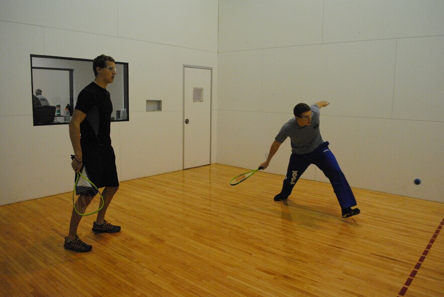 Airman 1st Class Trevor Runyan, right, and Airman 1st Class Caleb Mauchly, both pararescue students, practice Dec. 1 before the start of the Christmas Racquetball Tournament at the East Fitness Center.
Photo by Jonathan Rejent.
