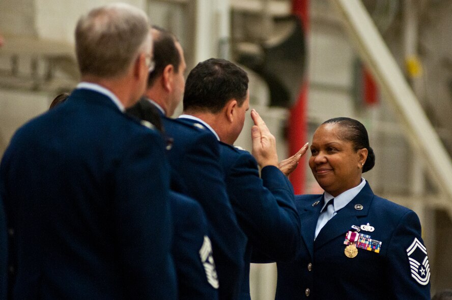 Senior Master Sgt. Morcie Whitley, 139th Airlift Wing, salutes Col. Michael Pankau, 139th AW commander, during an awards ceremony at Rosecrans Air National Guard Base Dec. 4, 2011. Whitley and other Airmen were awarded the Meritorious Service Medal for outstanding service. (Missouri Air National Guard photo by Staff Sgt. Michael Crane)